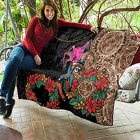 Black quilt blanket held open, featuring Aztec circle border, skull dancer, and florals