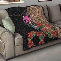 Black quilt blanket draped on sofa with Aztec circle panel, skull dancer, and floral print