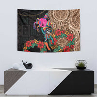 Black wall tapestry with Aztec circle design, colorful floral accents, and central skeleton figure