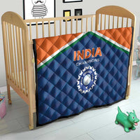 India Champions quilt on a baby bed, orange-and-blue flag design with 'INDIA' and cricket emblem.