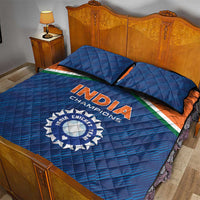 Blue quilt bed set with India Champions logo, orange border stripe, and quilted pillowcases