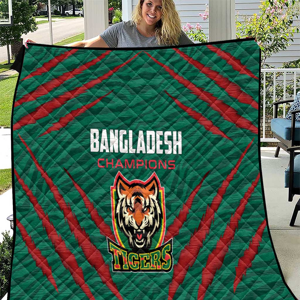 Green quilt with red diagonal stripes and Tigers logo, “Bangladesh Champions” text