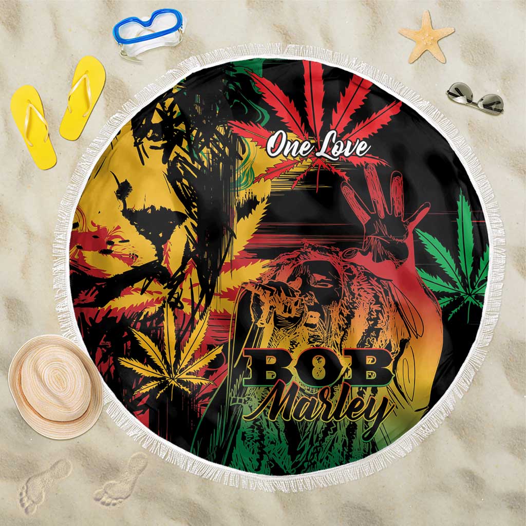 Round beach blanket with fringed edge; black print with reggae lion and 'One Love' text