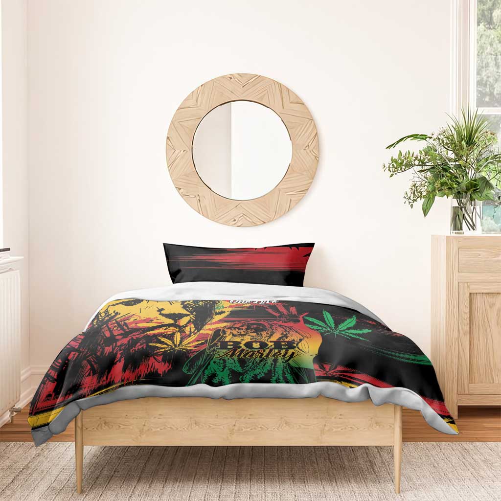 Black Marley duvet with One Love text, lion and cannabis leaf graphics in green and red