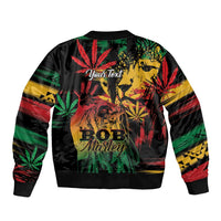 Black bomber jacket with back print, reggae lion and leaf graphics, striped sleeves