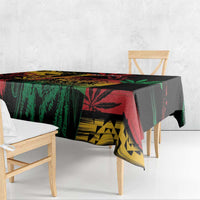 Black reggae tablecloth featuring colorful lion and leaf motifs with draped corner overhang.
