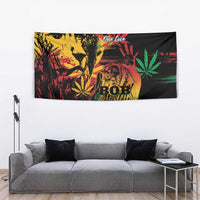Tapestry with Bob Marley portrait, 'One Love' and cannabis leaves, bright red green accents.