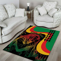Green reggae-style area rug with 'One Love' script, red-and-yellow crescent accents, and portrait art