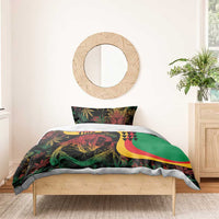 Reggae bedding set on bed with green lion duvet top and matching pillows, red/yellow crescent stripe