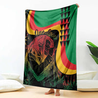 Reggae Marley throw blanket with face portrait, green field, and bold red-yellow shapes