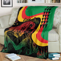 Reggae Marley throw blanket over an armchair, green-red-yellow graphics with portrait head