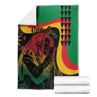 Reggae Marley blanket folded with portrait and One Love, green with red and yellow accents