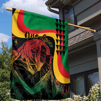 Green garden flag featuring a red lion portrait, bold yellow and red swooshes, One Love.