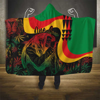 Green hooded blanket with large reggae lion print and One Love text, star pattern detail