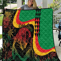 Green quilt with reggae lion portrait, red-yellow-green curved stripes and 'One Love' text
