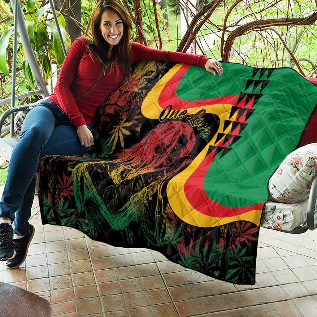 Green quilt draped with lion artwork, red and yellow curved stripes, 'One Love' text