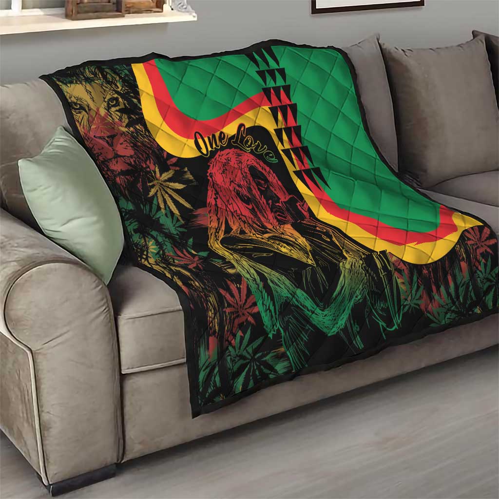 Green quilt on sofa with lion portrait, reggae stripes and 'One Love' lettering