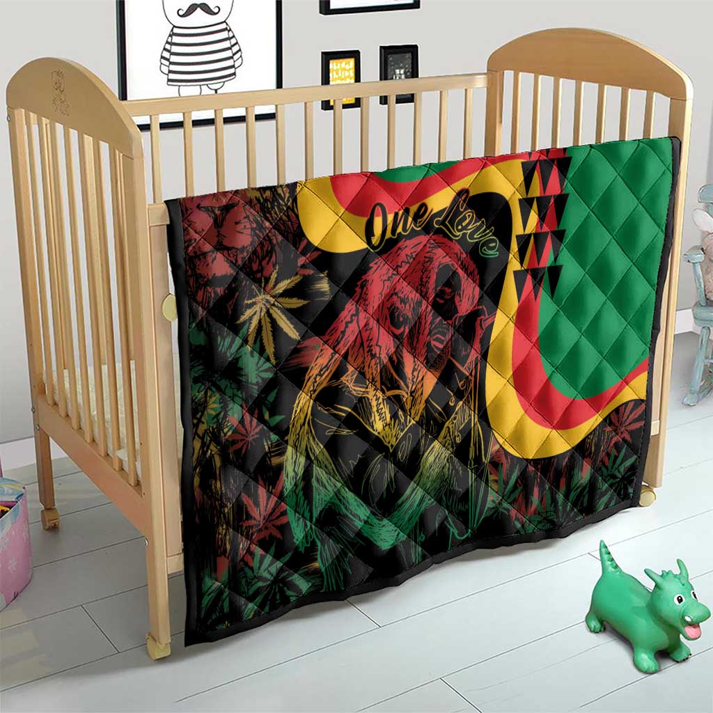Green quilt over crib: lion portrait, reggae curved stripes and 'One Love' text