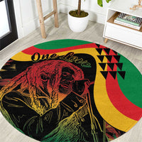 Round reggae-themed area rug with One Love script, lion graphic, and green-yellow-red accents