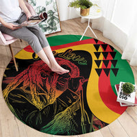Round reggae-themed area rug, black base with lion artwork and bold green, red, yellow patterns