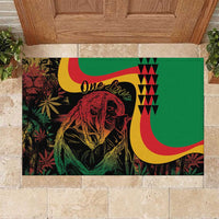 Green rubber doormat with One Love text and Marley portrait, red/yellow swooshes