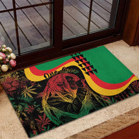 Green rubber doormat featuring Marley portrait, One Love lettering, yellow/red curved bands