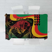 Green tablecloth with colorful reggae lion, crescent shapes, and geometric graphic print