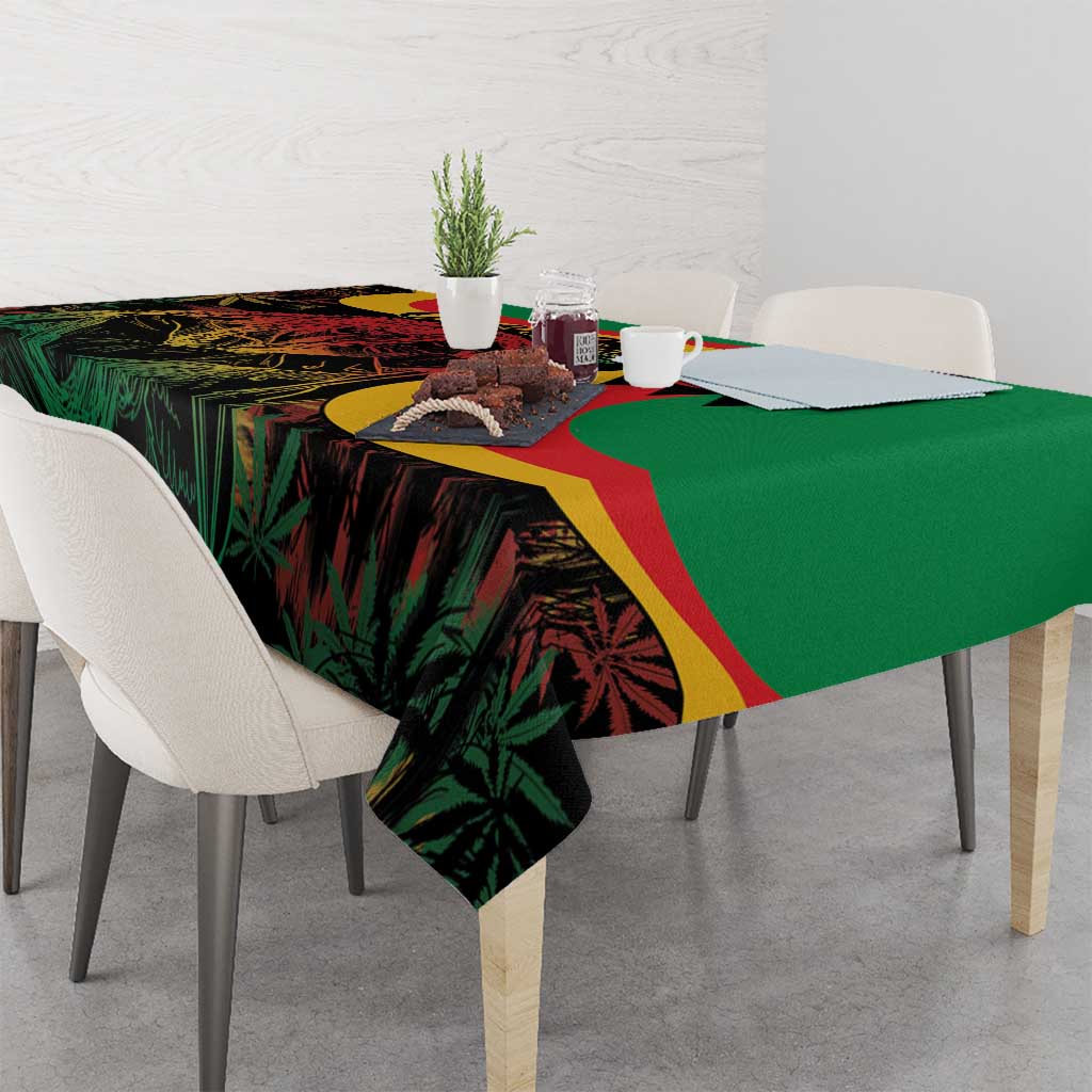 Green tablecloth with multicolor reggae print draped across table corner