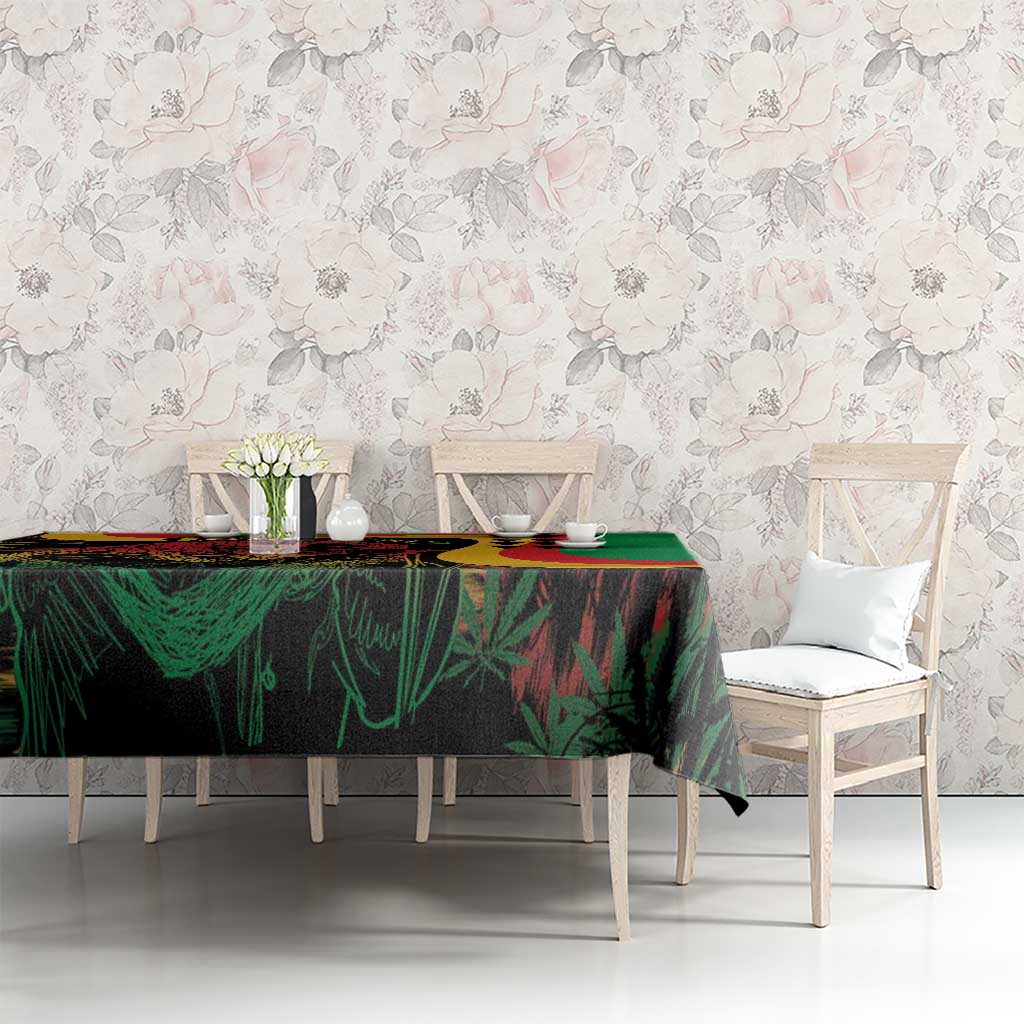 Green tablecloth with multicolor reggae graphic print covering the dining table
