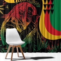 Close-up of green reggae print curtain fabric with red and yellow graphic portrait