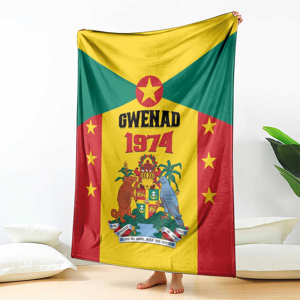 Grenada flag style fleece blanket with Gwenad 1974 crest and stars, spread on floor