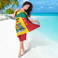 Grenada flag style sarong wrap, red yellow green panels with coat of arms and stars