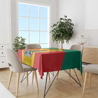 Flag-style Grenada tablecloth draped over a dining table with coat of arms graphic