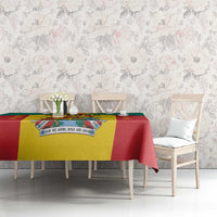 Grenada coat of arms tablecloth with red, green, and yellow stripe design on a table