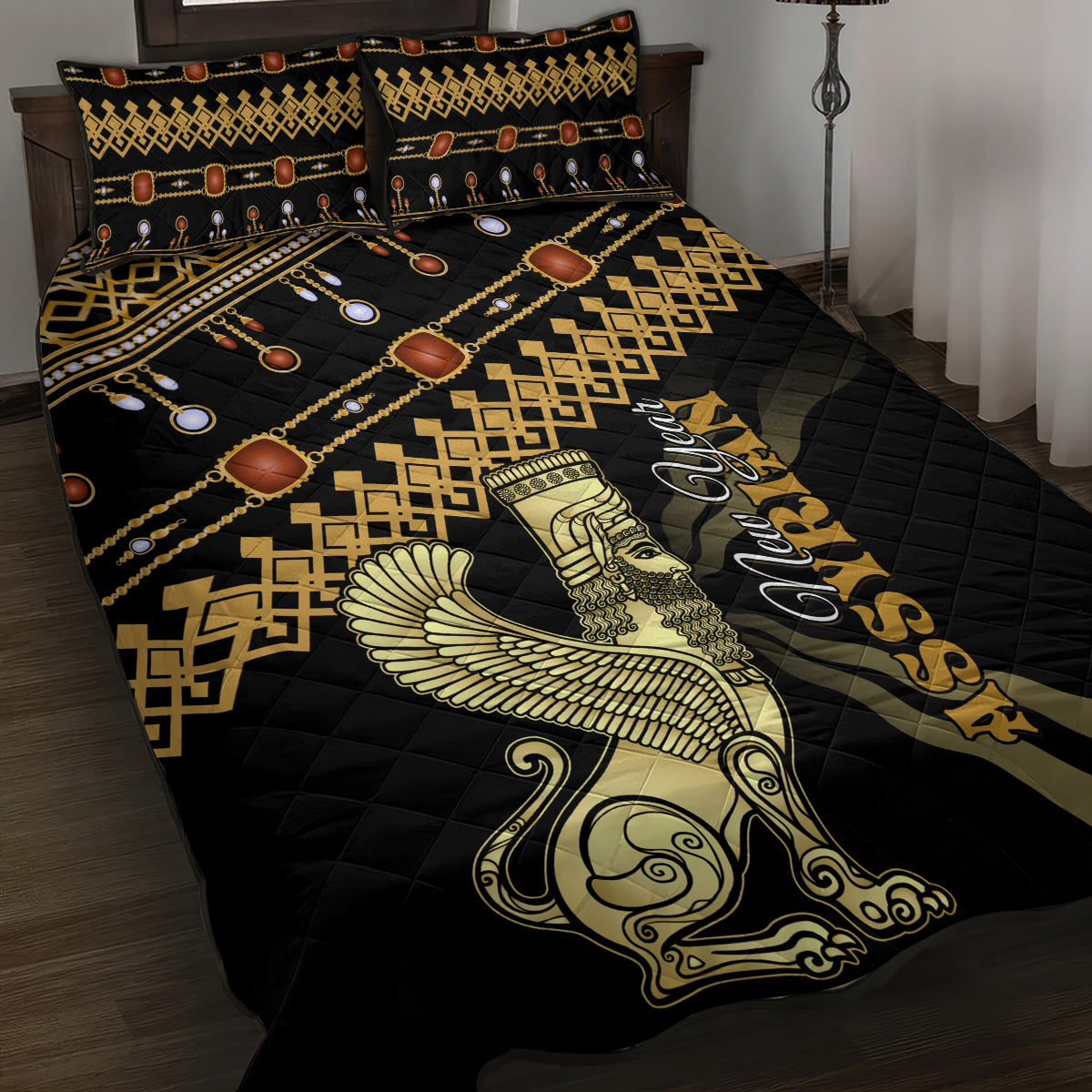 Black quilt bed set with gold geometric borders, circular motifs, and central winged figure