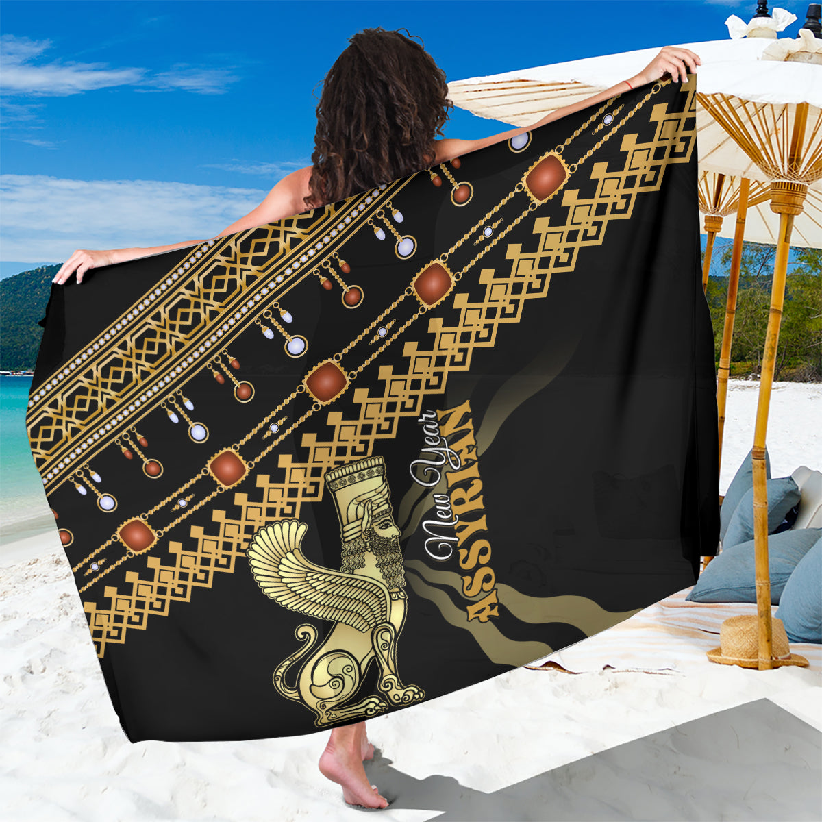 Black sarong with gold geometric border and ornamental figures, draped across shoulders