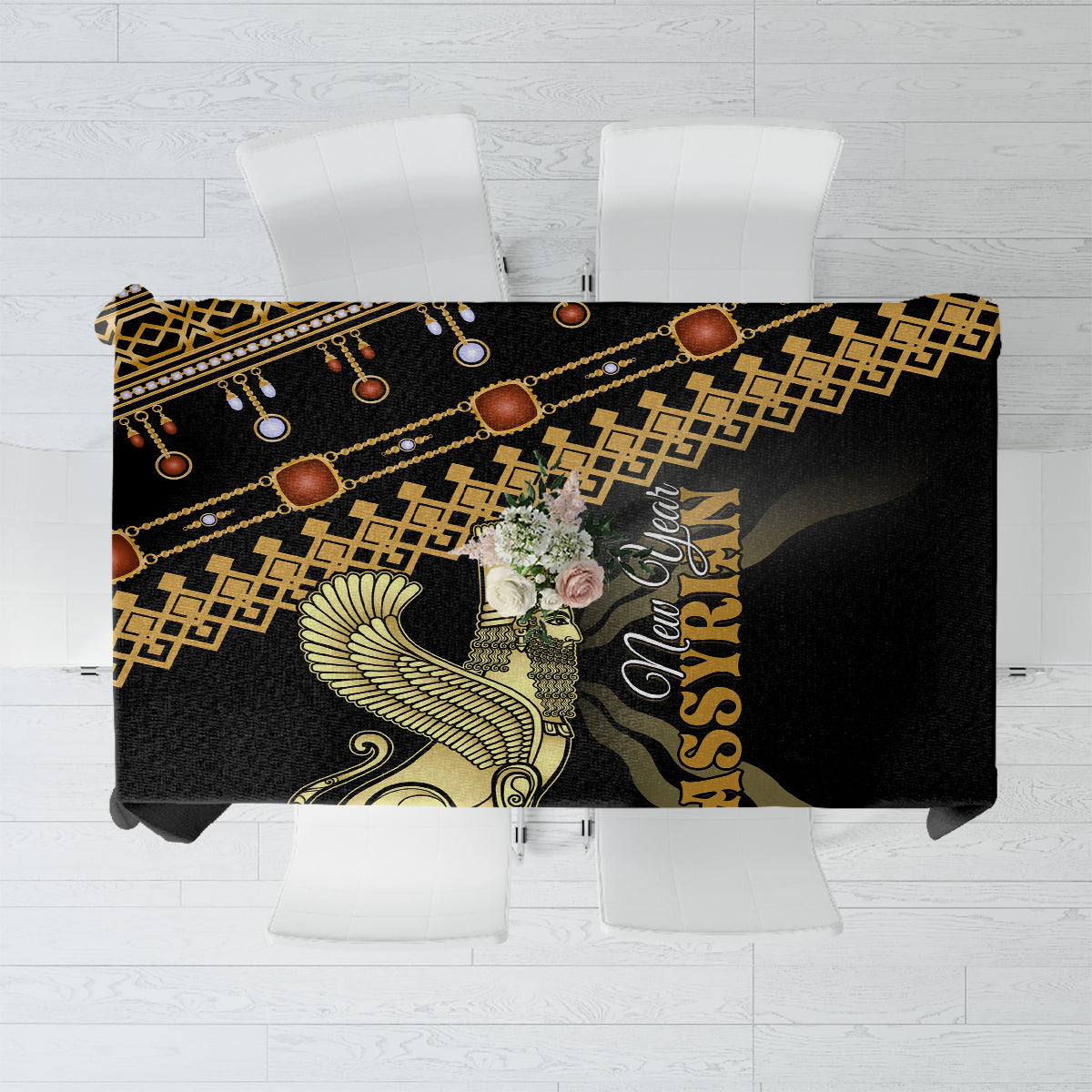 Black tablecloth with gold and teal ornate motif and geometric border across top