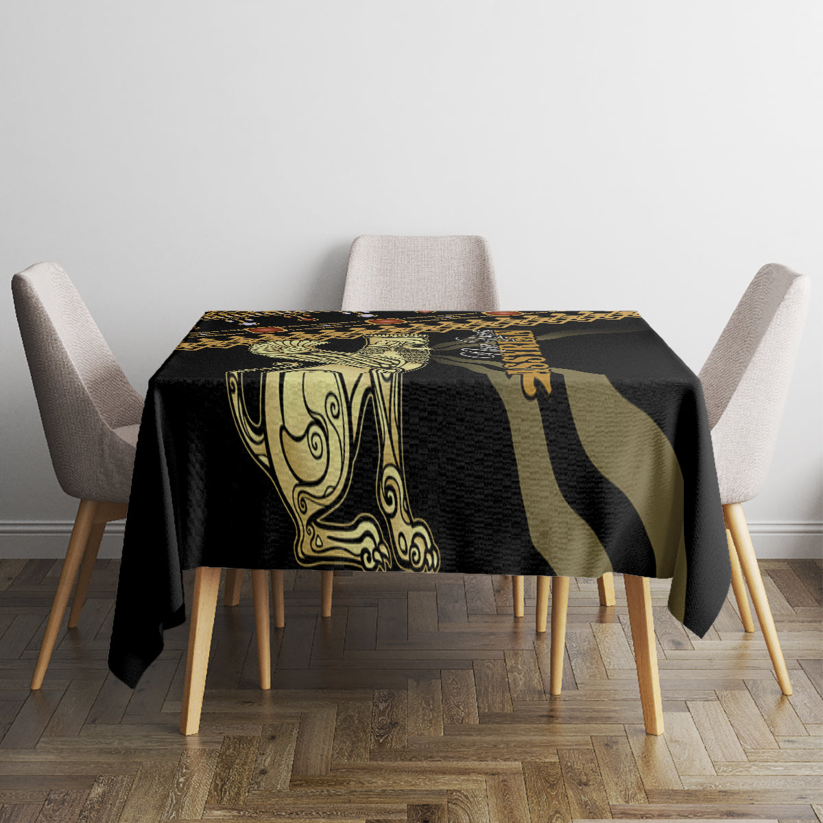 Black tablecloth with gold and green central figure motif and geometric stripes, on square table