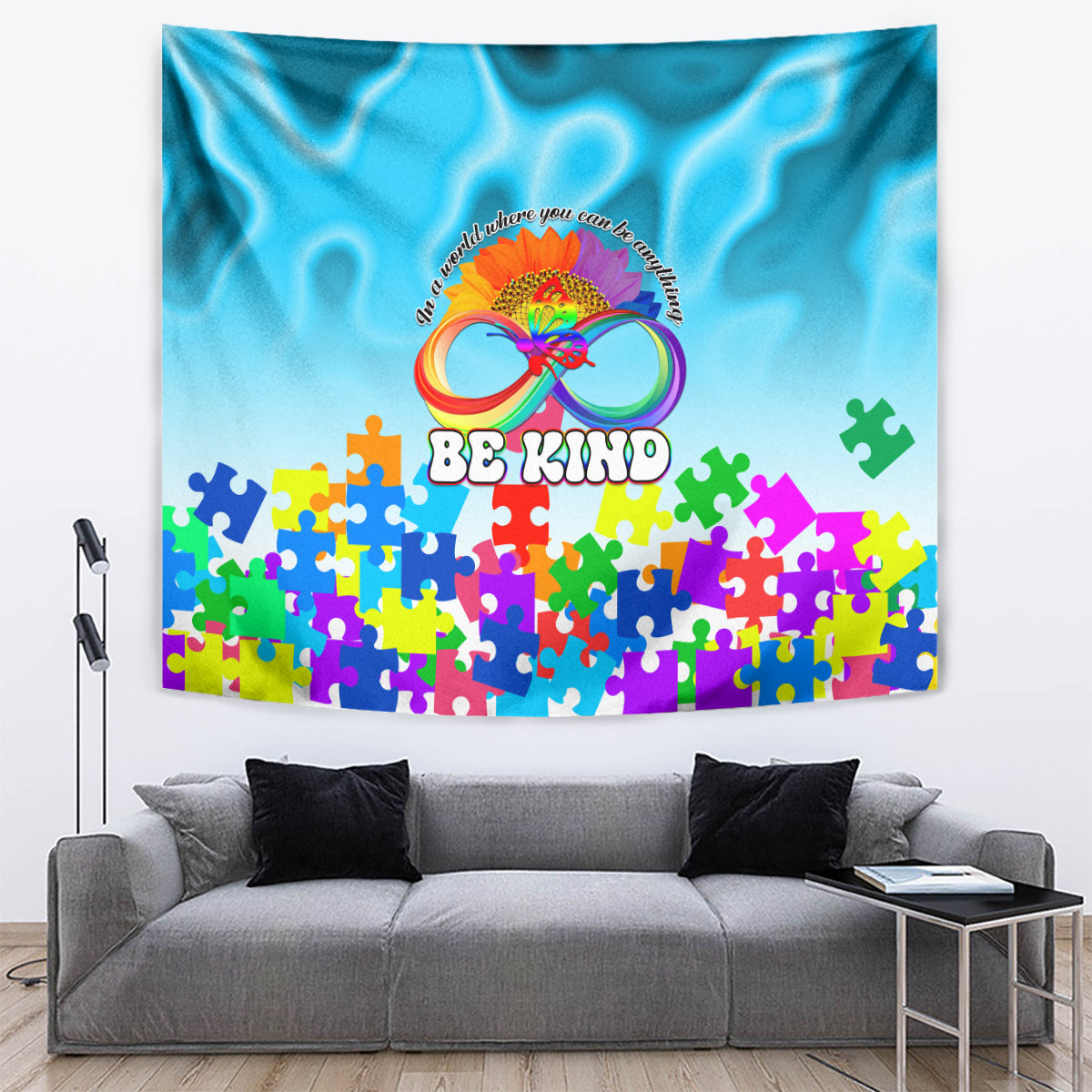 Blue autism awareness tapestry with rainbow infinity, colorful puzzle pieces, and 'Be Kind'.