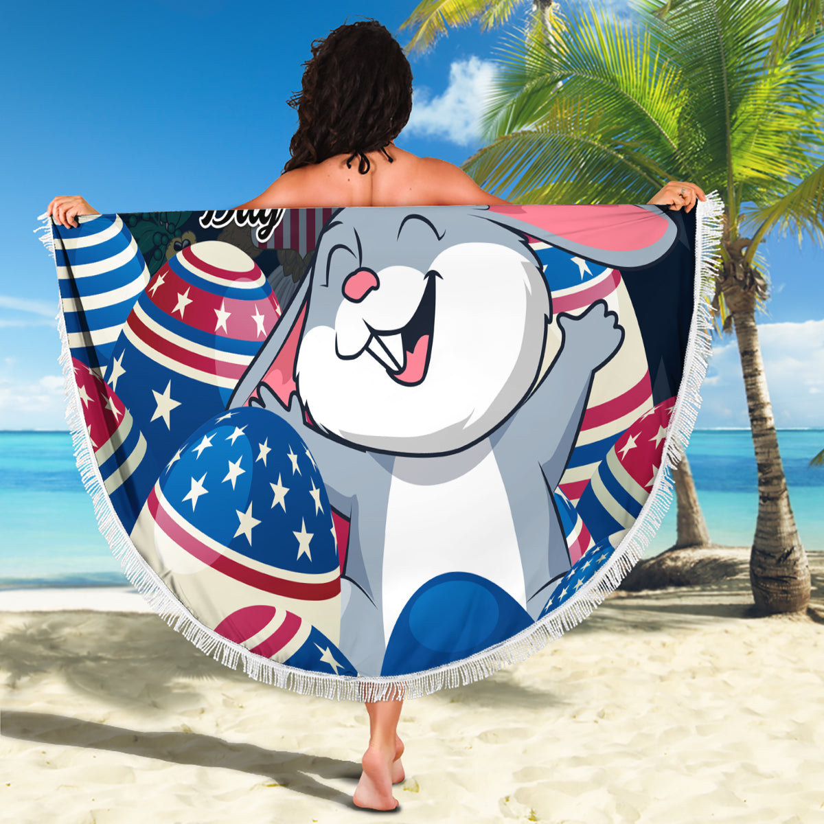 Round Easter beach blanket with white fringe, Happy Easter bunny and US egg prints, draped