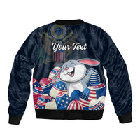 Blue bomber jacket back with bunny holding stars and stripes eggs, 'Your Text'