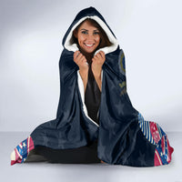 Navy hooded blanket with bunny Easter egg print, woman wearing with hood up