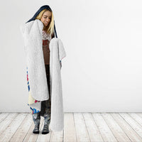 Navy hooded blanket with bunny Easter egg print, woman wearing draped open-front look