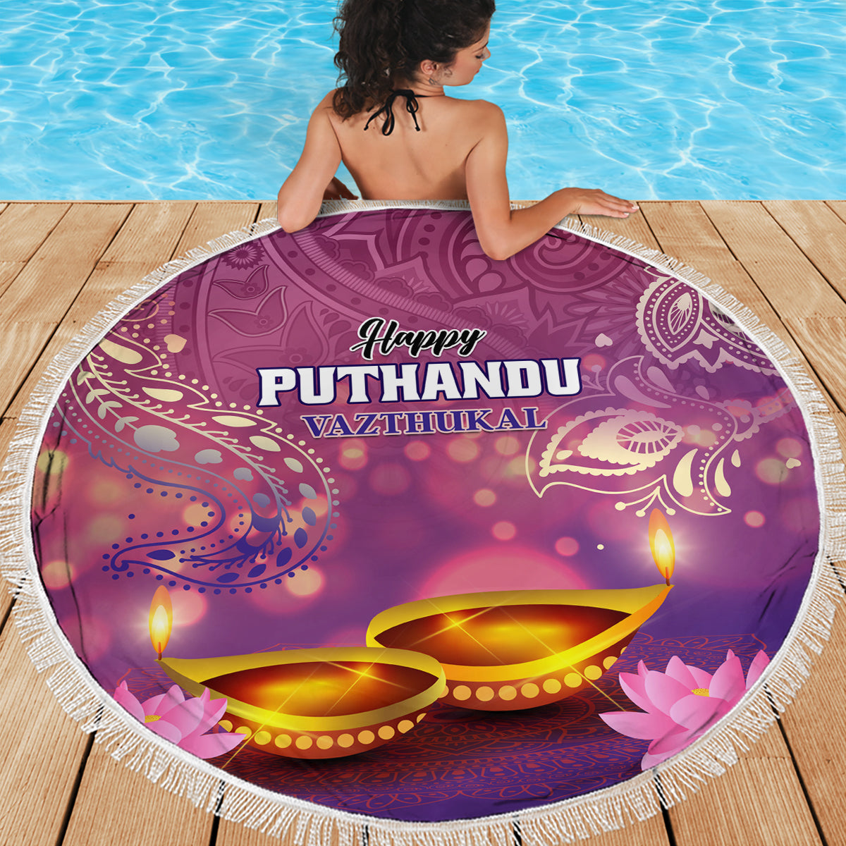 Purple round beach blanket with fringe edge, 'Happy Puthandu Vazthukal' and diya candles