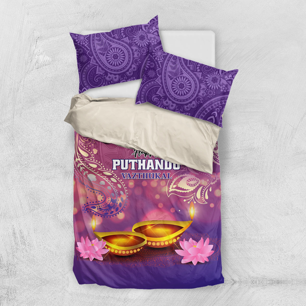Purple duvet and pillowcases set with 'Happy Puthandu Vazhuthukal' and diya lights