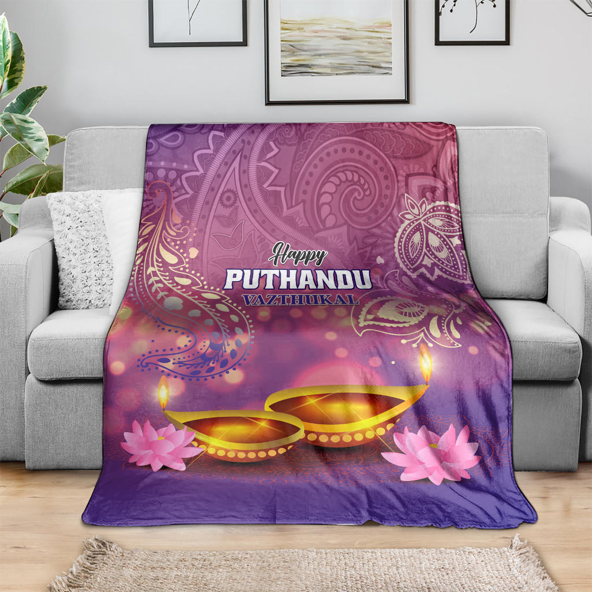 Purple Happy Puthandu blanket draped on sofa, featuring diya lamps and pink flowers