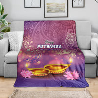 Purple Happy Puthandu blanket draped on sofa, featuring diya lamps and pink flowers