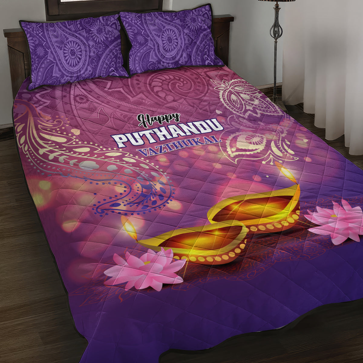 Purple quilt bed set with two pillows; Happy Puthandu Vazhthukal and floral motifs.