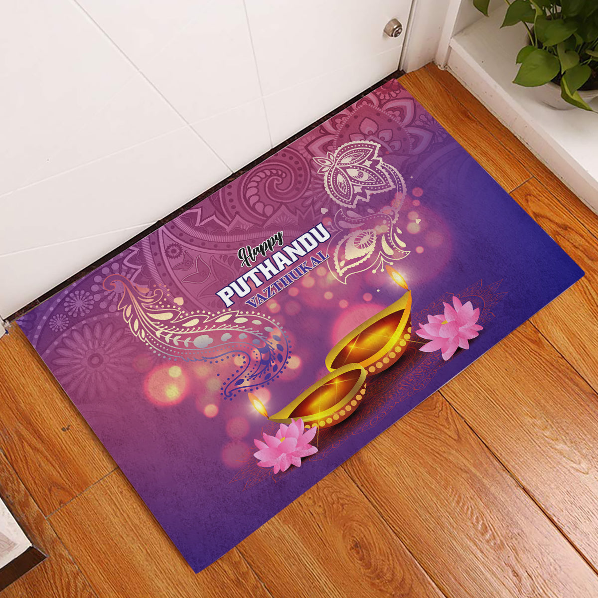 Purple rubber doormat with Happy Puthandu text, golden lamps and pink flower designs