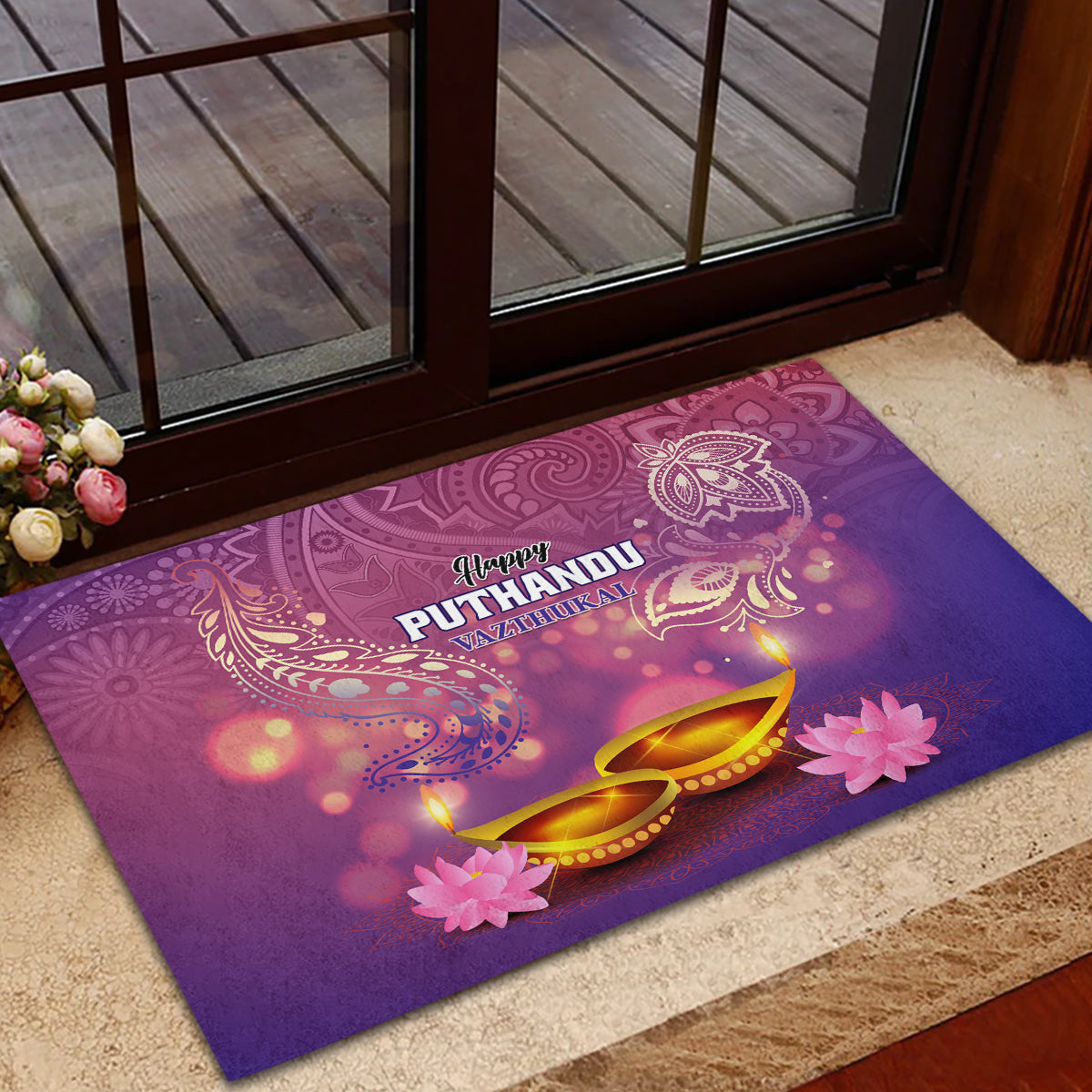 Purple rubber doormat with 'Happy Puthandu' wording, golden oil lamps, pink blossoms